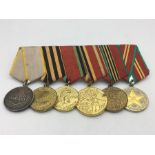 . Soviet Russian, world war two and postwar anniversary medals. Comprising:medal for combat service;