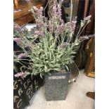 A Faux Lavender plant in metal planter