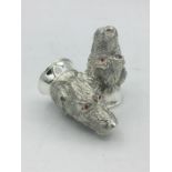 A pair of unusual continental silver condiments in the form of digs with ruby eyes