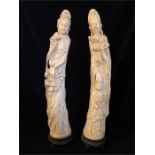 A pair of Faux Ivory Oriental statues