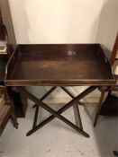 A George III mahogany butlers tray with three quartered galleryand gally stand