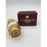 A Krug Champagne stopper in original box