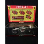 A Matchbox Ferrari set MC-18 and a boxed McLaren M.Hakkinen Formula One car