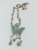 A substantial silver and opal butterfly necklace