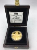 A London Mint Pope John Paul II commemorative coin in 9ct (24ct gold plate finish) £5 denomination