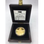 A London Mint Pope John Paul II commemorative coin in 9ct (24ct gold plate finish) £5 denomination
