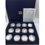 A cased set of silver proof £5 'A Royal View' twelve coins in total