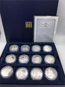 A cased set of silver proof £5 'A Royal View' twelve coins in total