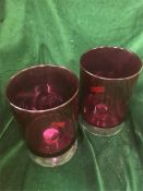 A Pair of pink glass candle holders