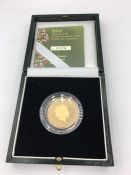 A gold proof 22ct £2 coin celebrating the discovery of DNA