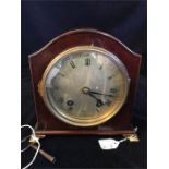 A late Victorian 16cm high, Arch top Mahogany cased and steel faced mantel clock with ebony string