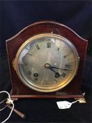 A late Victorian 16cm high, Arch top Mahogany cased and steel faced mantel clock with ebony string