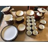 A Volume of Poole pottery brown coffee and dinner service pieces, to include 10 cups and saucers,