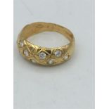 A Persian gold and diamond ring