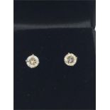 A pair of 14ct white gold diamond stud earrings of 1ct.