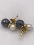 A pair of yellow metal cultured pearl earrings