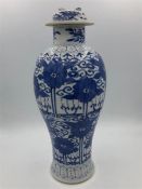An 18th Century blue and white Chinese vase, with broken lid.