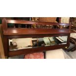 A Mahogany hall mirror with shelf