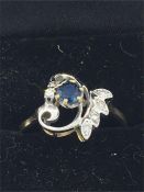 A 14ct yellow gold sapphire and diamond ring