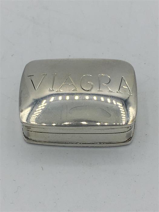 A Sterling silver pill box with 'Viagra' on the front.