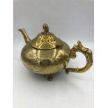 A gold colour teapot