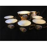 A set of five Czechoslovakian gold tea cups and saucers, milk jug and sugar bowl