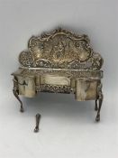 Silver hallmarked jewellery box in the style of a dressing table or ornate chiffonier(Leg broken but