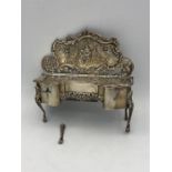 Silver hallmarked jewellery box in the style of a dressing table or ornate chiffonier(Leg broken but