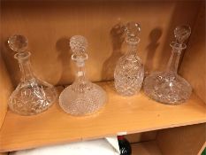 A selection of four glass decanters