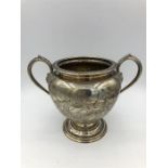 A silver sugar bowl