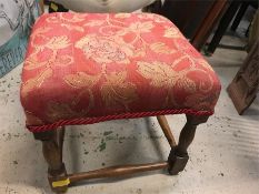 A red fabric covered stool