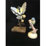 An Albany Fine China Co Ltd china and hand painted figures of a Blue Tit and a Great Tit