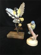 An Albany Fine China Co Ltd china and hand painted figures of a Blue Tit and a Great Tit