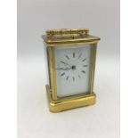 A Brass Carriage clock, repeat striking in a carry case