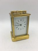A Brass Carriage clock, repeat striking in a carry case