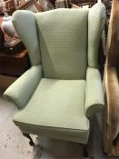 A wing back chair