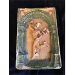 A rectangular glazed wall panel of Achilles inset in decorative archway in pale green and light