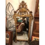 19th Century carved gilt mirror with urn of flowers and full scroll