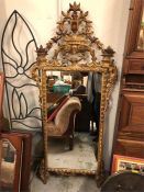 19th Century carved gilt mirror with urn of flowers and full scroll