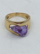 A Gold and Amethyst ring