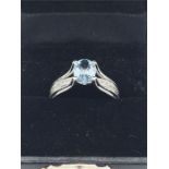 A 14ct white gold Aquamarine and diamond halo style ring