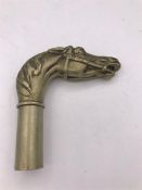 A Horse brass walking stick