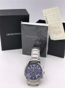 An Armani watch in original box with warranty