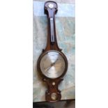 A mid Victorian Wheel Barometer with siphon tube by A J Marks of Sunderland with arch top and fitted