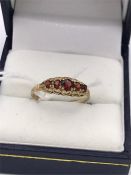 A 9ct gold and garnet ring