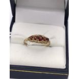 A 9ct gold and garnet ring