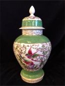 A Lidded vase with bird decoration