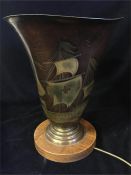 A Metal uplighter lamp with Crusade ship style decoration