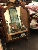 A small mahogany swing miror