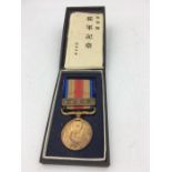 Japanese Cased China incident war medal 1939 with award document.